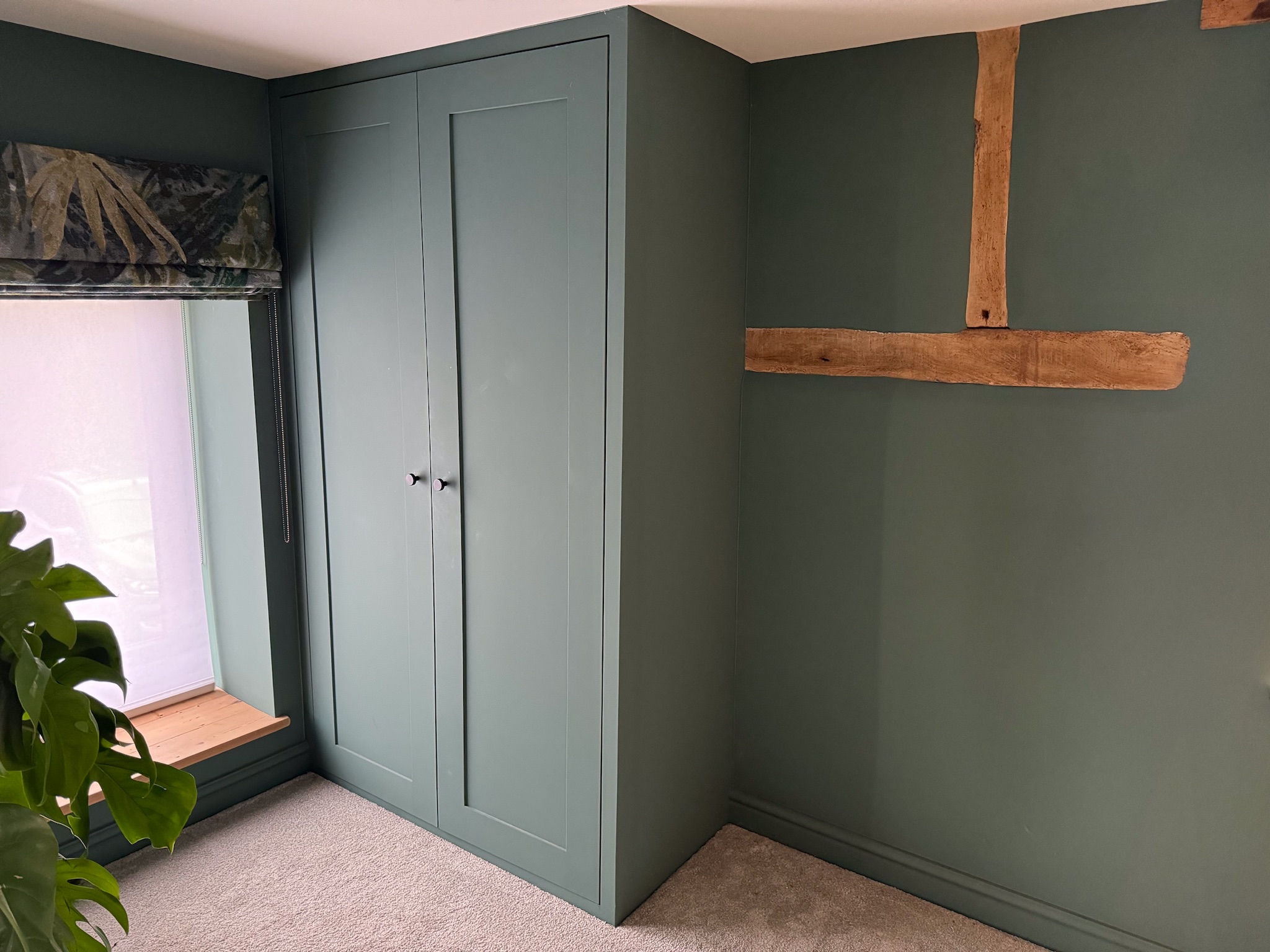 Elm features in barn conversion. Built in wardrobe