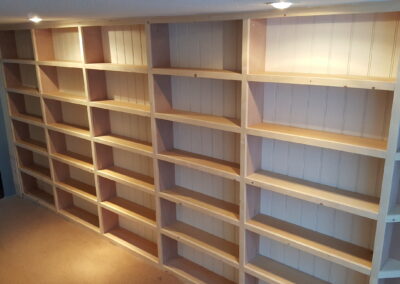 Built in bookcase in narrow hallway