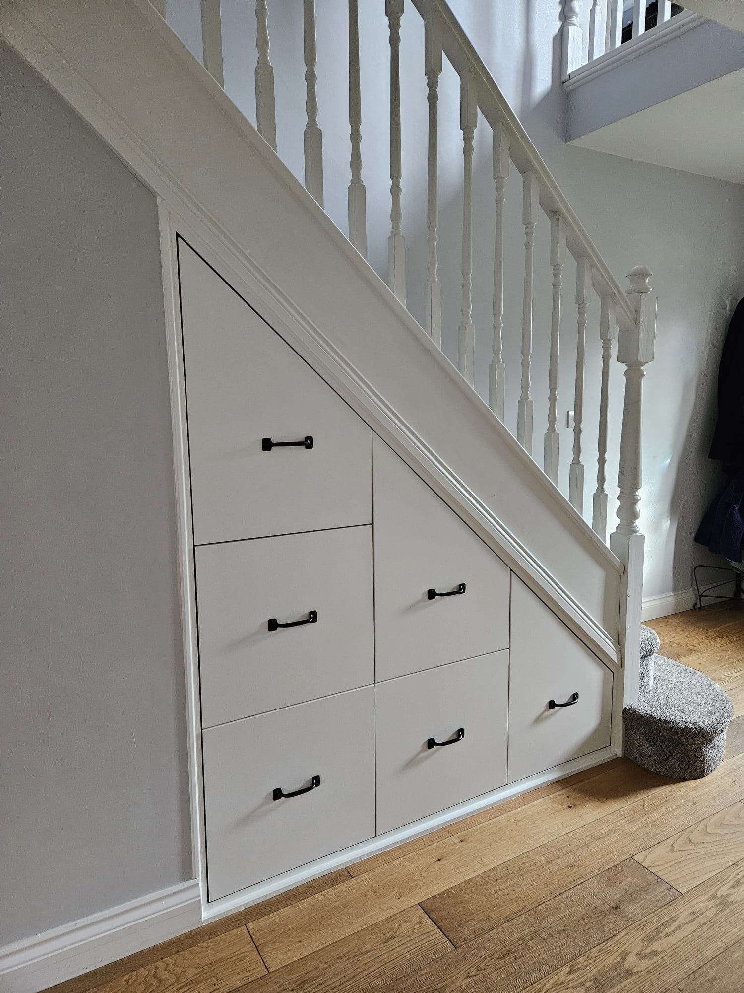Built in storage under stairs