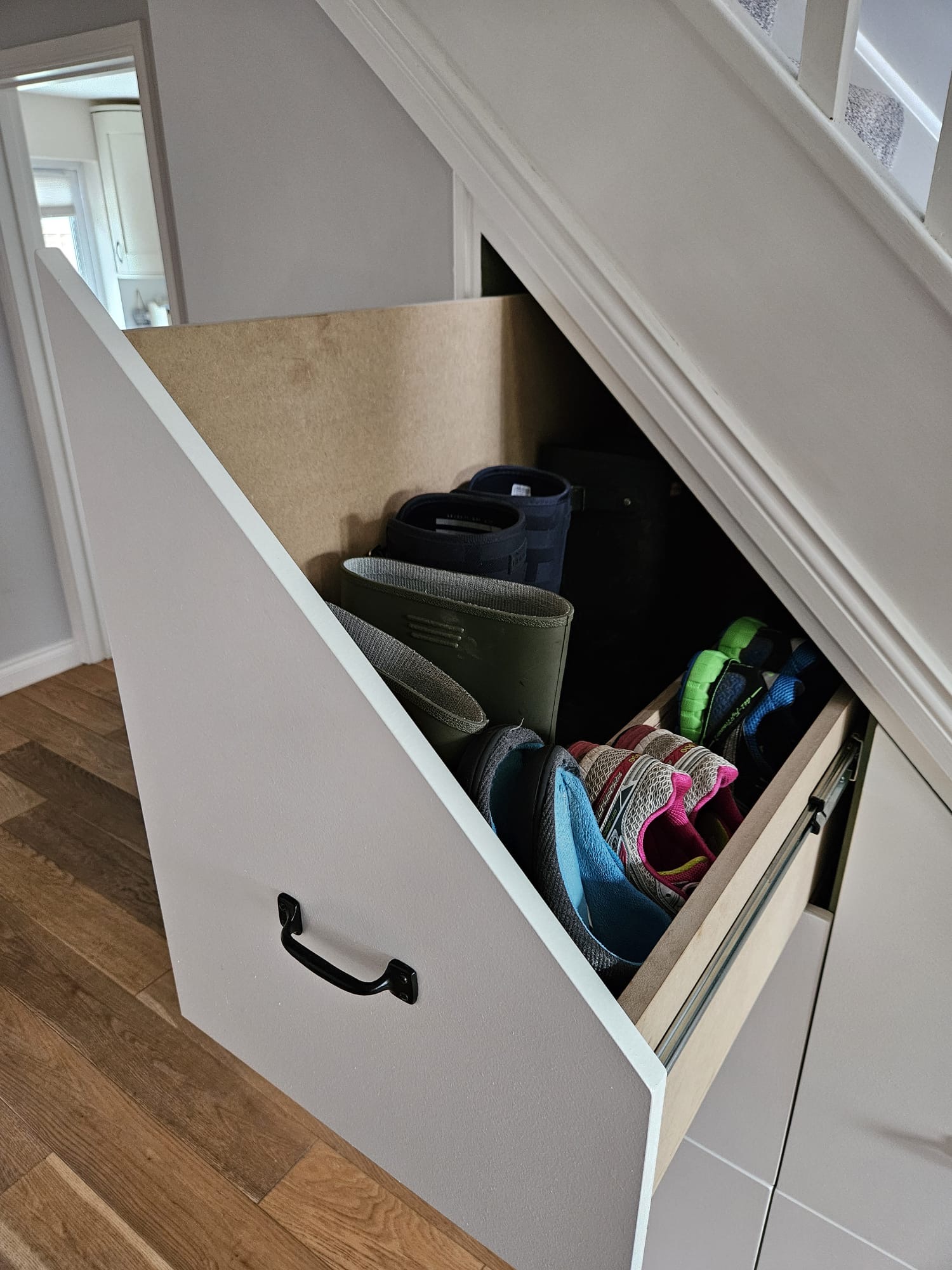 Shoes in under stair storage unit