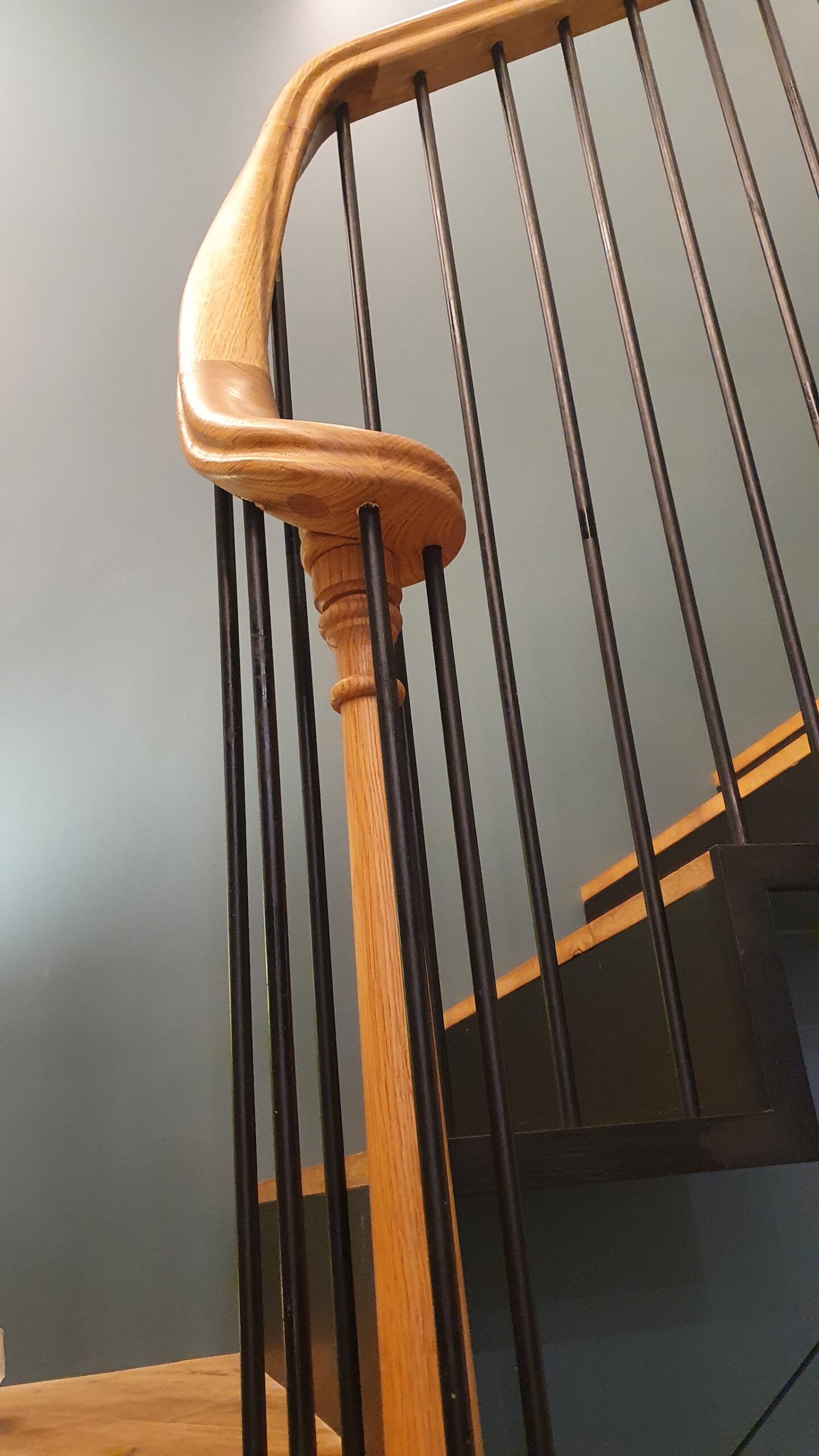 bespoke oak tangent handrail ending into a small volute.