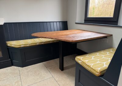 Gallery kitchen refit. Reclaimed elm table with built in storage benches