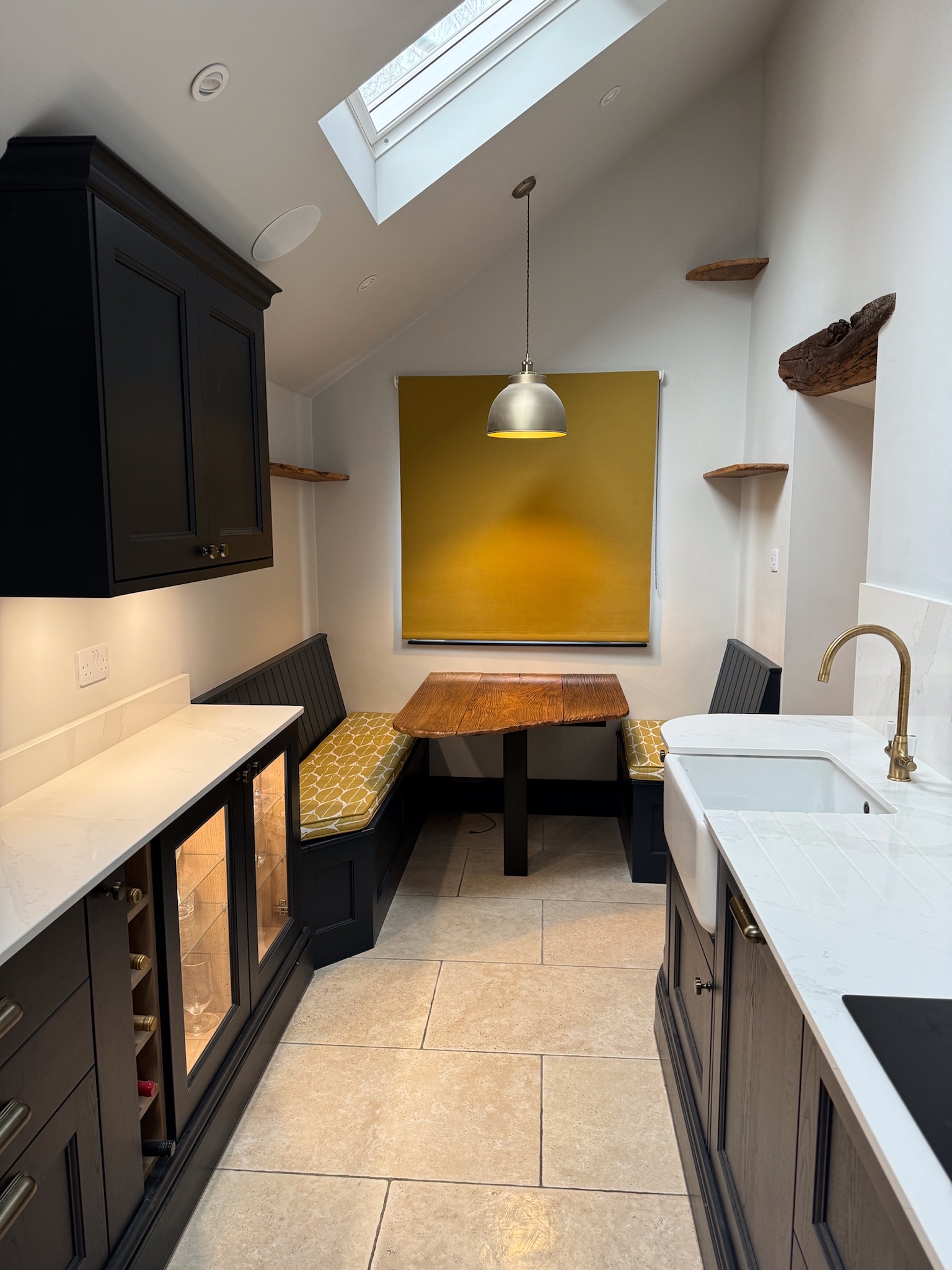 Dark blue gallery kitchen with white quartz work top
