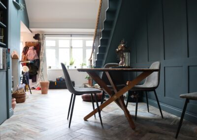 oak table, bespoke stairs, pannelled wall