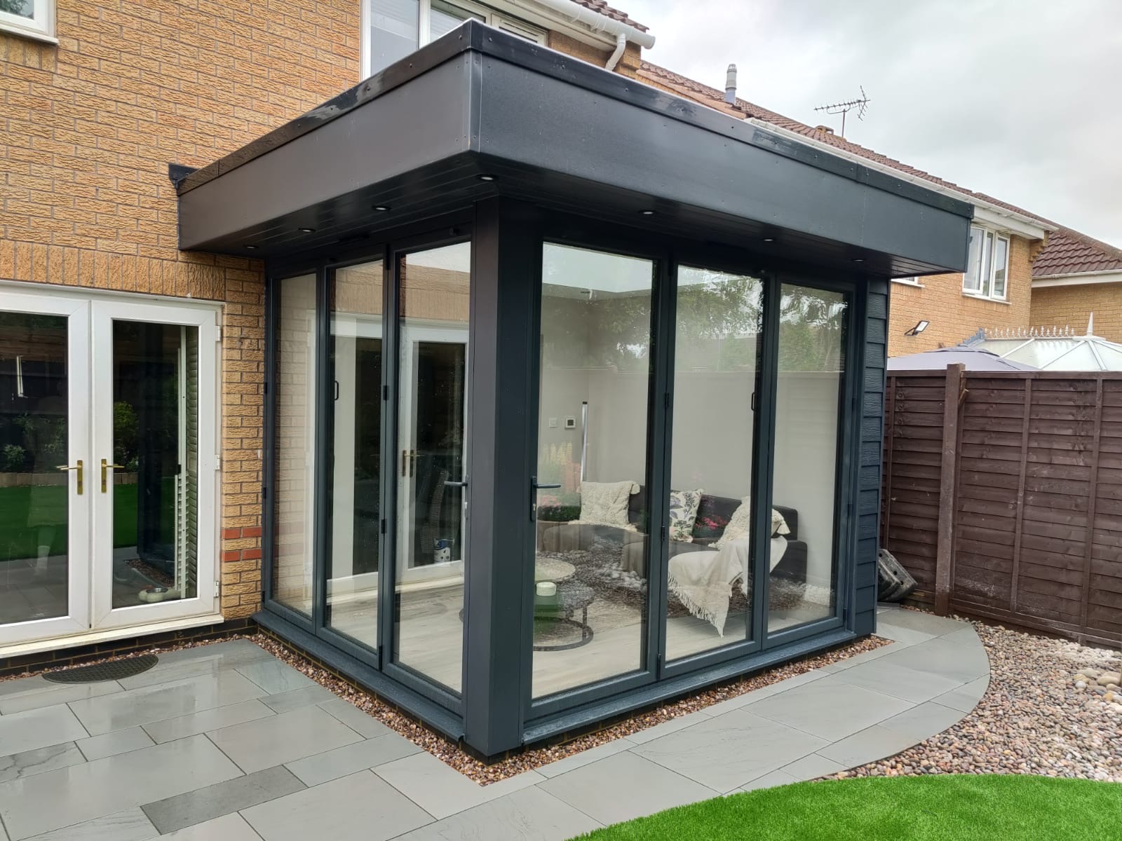Modern orangery with closed bi-folds