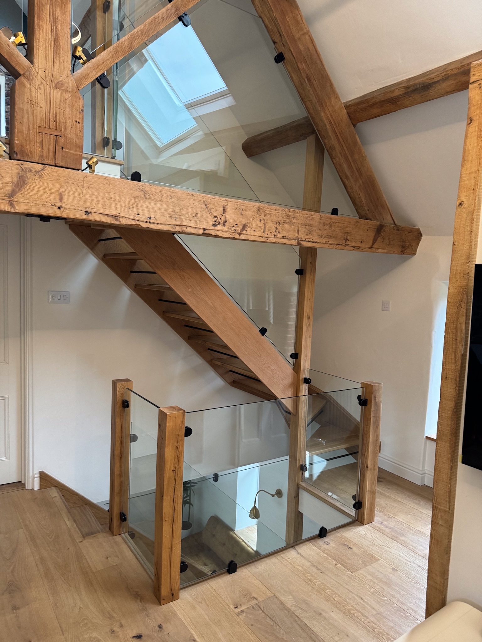 Oak stair case with glass balustrade